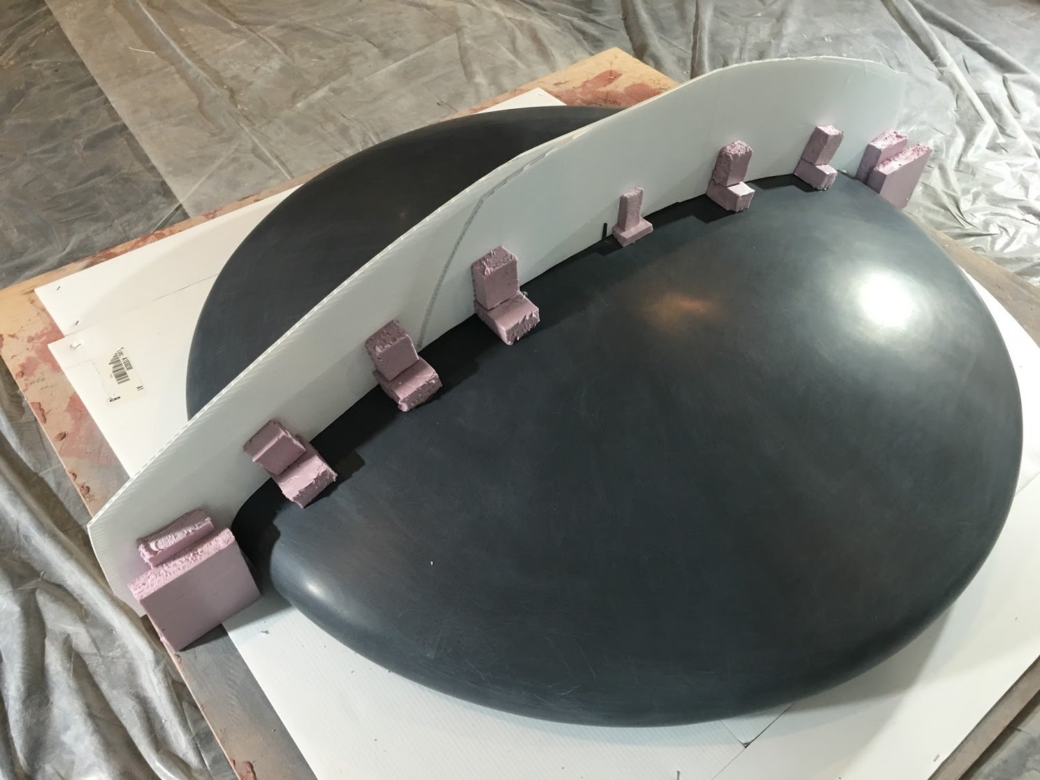 First half of mold to be formed on side opposite from the pink styrofoam