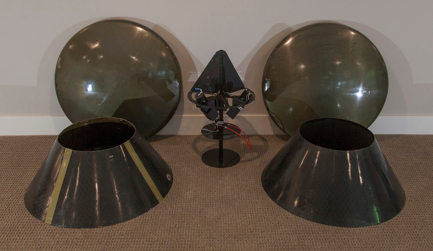 This is what we're making: One-meter diameter aeroshells. Lower shells along the wall, upper shells on the floor,&nbsp;HAPP structure in the middle.